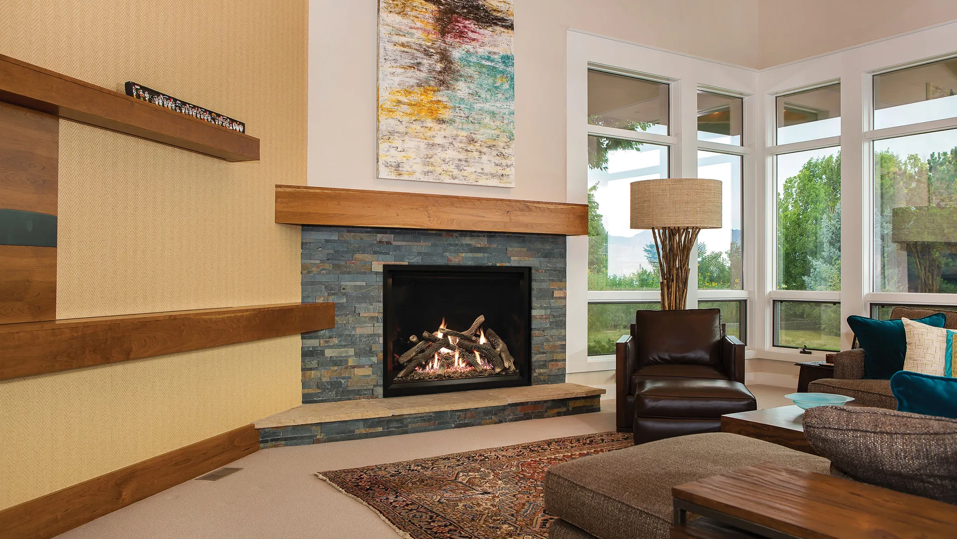 An American Hearth gas fireplace lit in a slate surround with a timber mantel